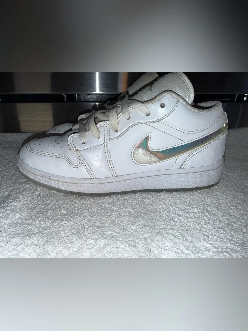 Nike Air Jordan’s White Low-Top Sneaker with Iridescent Swoosh Size 5Y